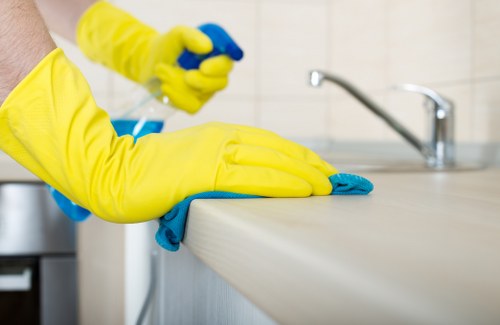 Cleaner wearing PPE while working in a safe and controlled environment
