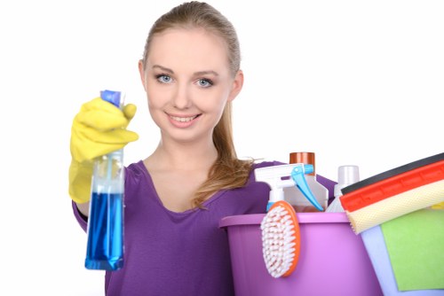 Cleaner preparing kitchen and bathroom surfaces in a Richmond property